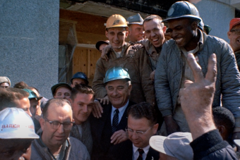 President Lyndon B. Johnson campaigning with construction workers